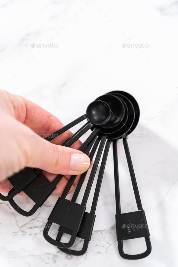 Measuring cups and spoons Stock Photo by arina-habich