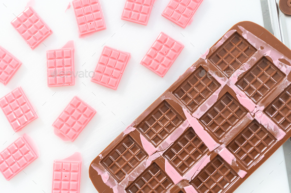 Mini pink chocolates Stock Photo by arina-habich