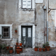 Antique building facade, flower pots - PhotoDune Item for Sale