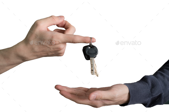 Hand handing over car keys with finger and hand receiving
