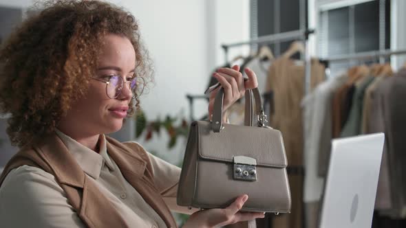 Small Business Charming Female Salesperson Video Calls and Sells Products Online While Sitting in alt