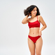 Confident and middle eastern brunette woman in red bra touching panties  Stock Photo by LightFieldStudios