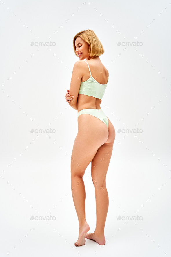Sexy Blond Tempting Woman Touching Her Panties Stock Photo