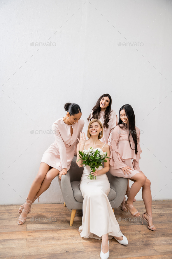 wedding photography, cultural diversity, four women, joyful bride with bouquet showing her