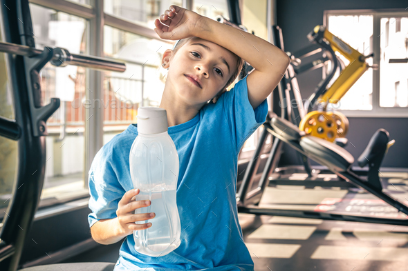 Sporty Teen With A Water Bottle After Exercise Stock Photo