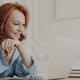 Redhead European woman enjoys distance learning in her home office, focused on laptop screen - PhotoDune Item for Sale