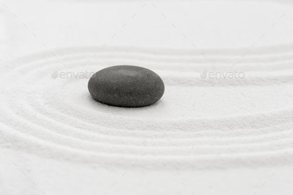 Zen Garden with Grey Stone on White Sand Line Texture Background in Japanese stye, Zen like concept.