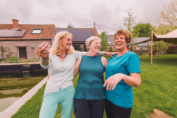 third age friendship - senior women laughing happily together
