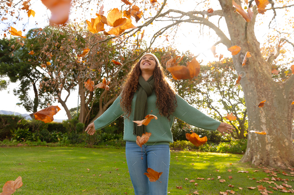 Happy Woman Enjoying Life in the Autumn on the Nature Stock Photo