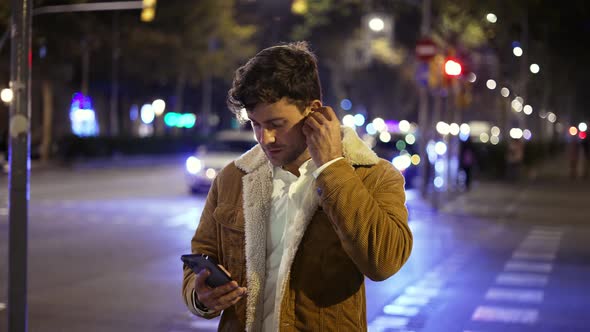 Man Browsing Social Media on Street alt