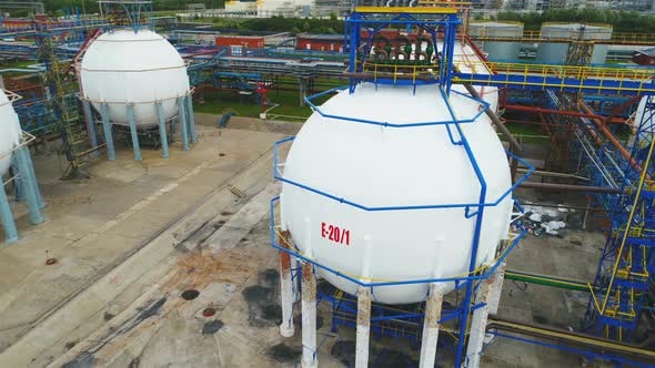 Drone Rotates Above Oil Tanks on Petrochemical Plant Territory alt