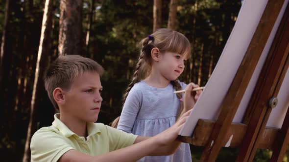 Happy Family Boy and Girl Drawing Coloring Picture with Brush Helping Cute Child Daughter Enjoying alt
