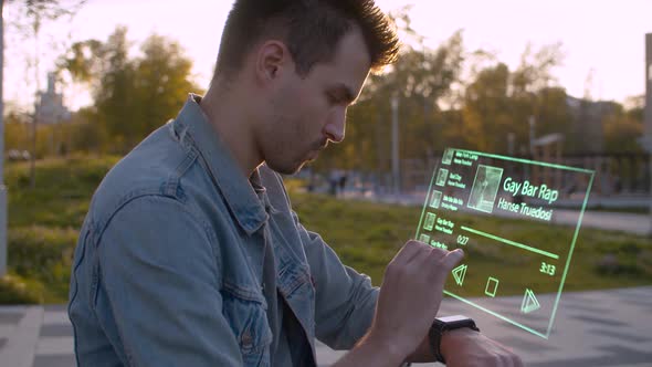 Man in the city park using futuristic device