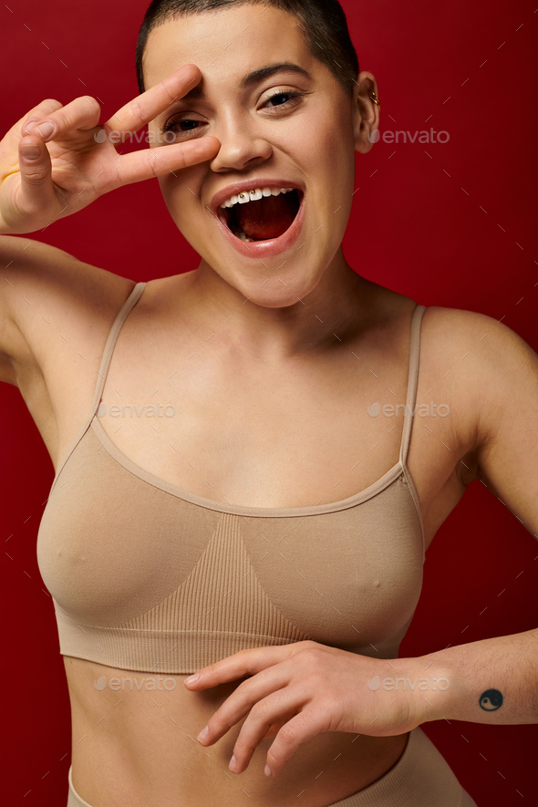 sexy girl in red underwear standing near handrail with closed eyes and  holding white shirt Stock Photo by LightFieldStudios