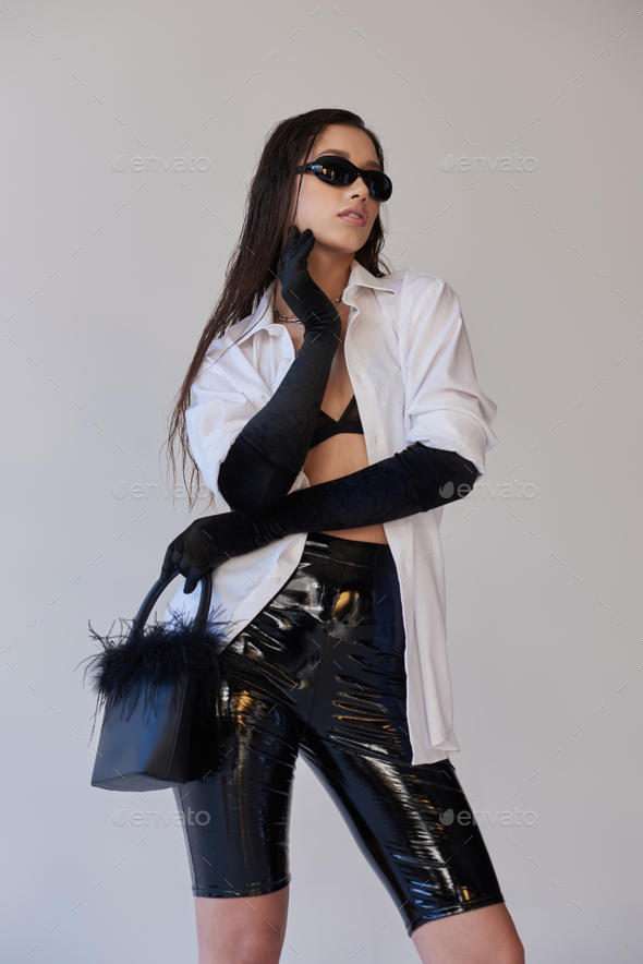 bold style, fashion statement, asian woman in sunglasses posing