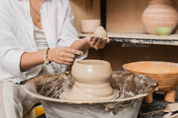 Creative, pottery and design with hands of woman in workshop