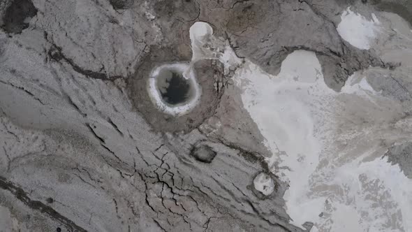 unique phenomenon in dead sea desert, sinkhole filled by flood water, top shot zoom out alt
