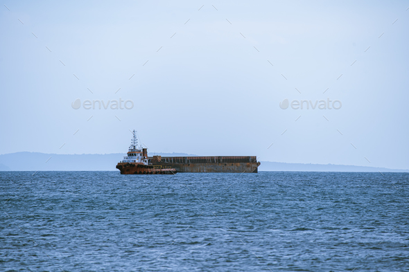 Tugboat and barge on the sea