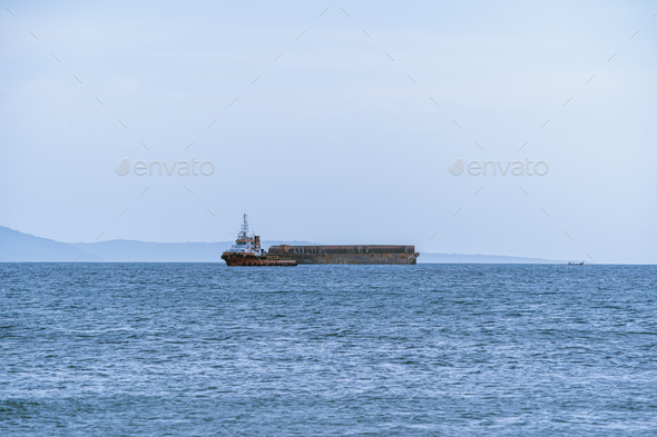 Tugboat and barge on the sea