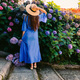 A woman in a long blue dress with beautiful flowers  - PhotoDune Item for Sale