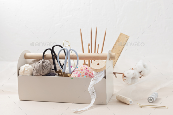 Sewing, knitting supplies and accessories for needlework in craft tool box  Stock Photo by OksaLy