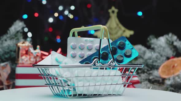 Pills in a miniature shopping cart for new year and christmas. Pills purchase concept