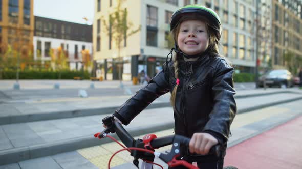 Extremely Cheerful Girl in Helmet Sitting on Bike and Sincerely Smiling, Hobby