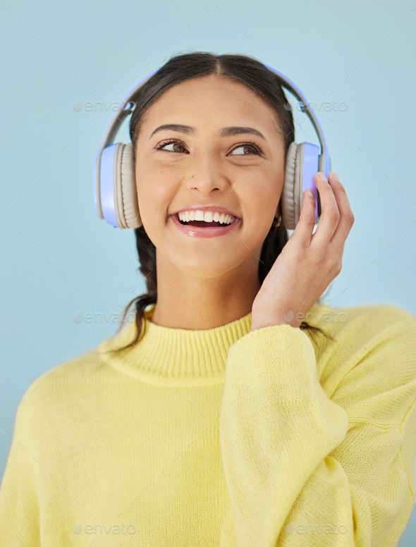 Woman with smile, headphones and mockup in studio for podcast, mobile app and streaming radio site.