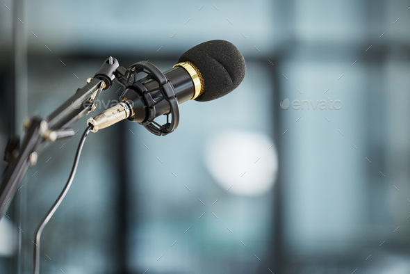 Conference, auditorium and microphone in an office for a speech, work event or presentation. Bokeh,