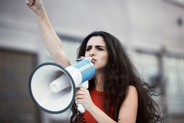Megaphone, woman and shouting for social change, justice for equality and humanity with activist on