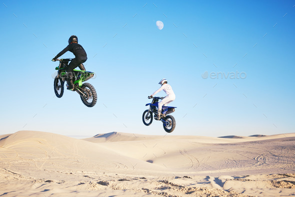 Motorcycle, desert and jump in sky, speed and competition at outdoor race for performance, goal or