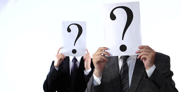 Business People Shaking Question Mark Signs