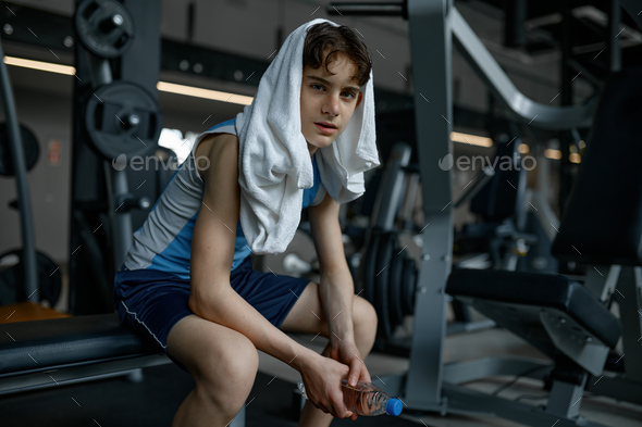 Fit Young Woman Sweating during a Gym Workout with Rings Stock