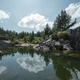 Reflections in the calm waters that fill an abandoned quarry - PhotoDune Item for Sale