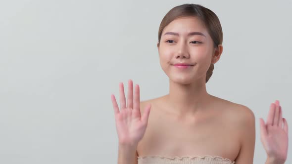 facial beauty skin concept asian female attractive and healthy skin closeup hand touch softy face alt