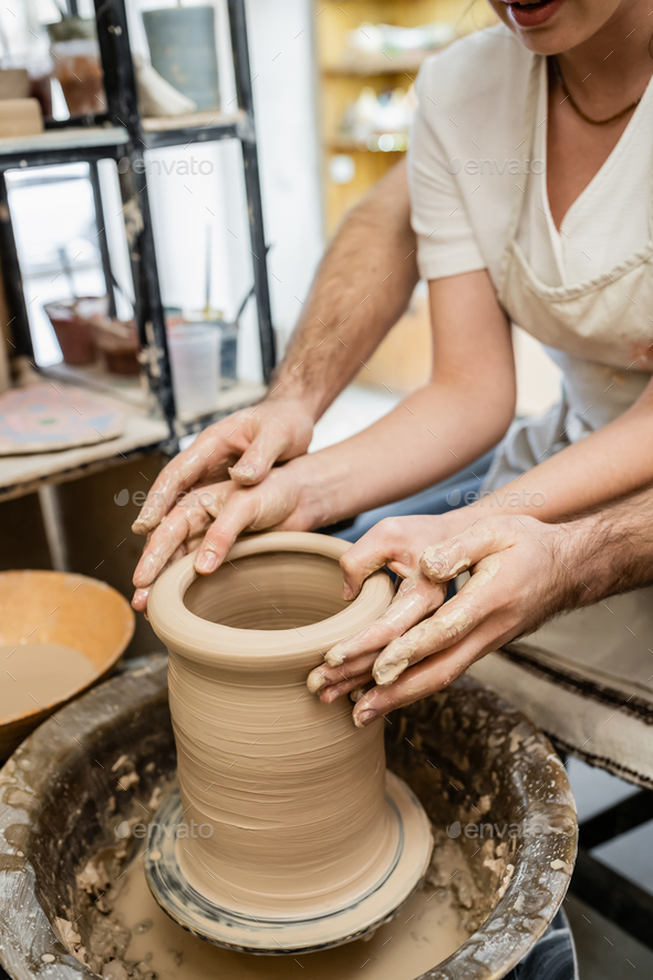 Molding clay on the wheel