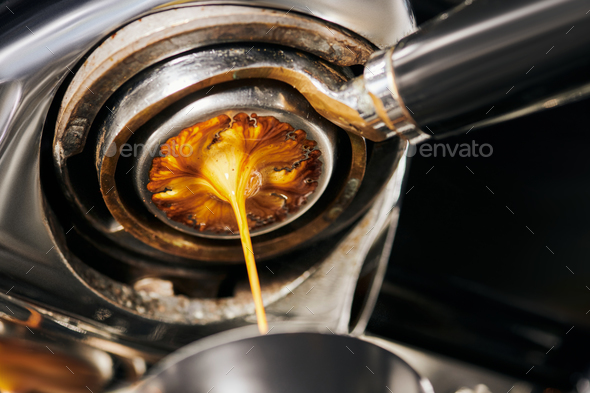 black coffee, extraction, fresh espresso dripping into cup, professional  coffee machine Stock Photo by LightFieldStudios