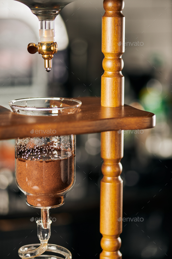 cold brew coffee maker, cold water dripping on fresh ground coffee