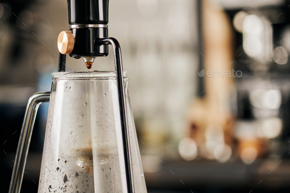 siphon coffee maker with fresh espresso in glass coffee pot on