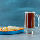 A blue plate of crispy chips with glass of beer - PhotoDune Item for Sale