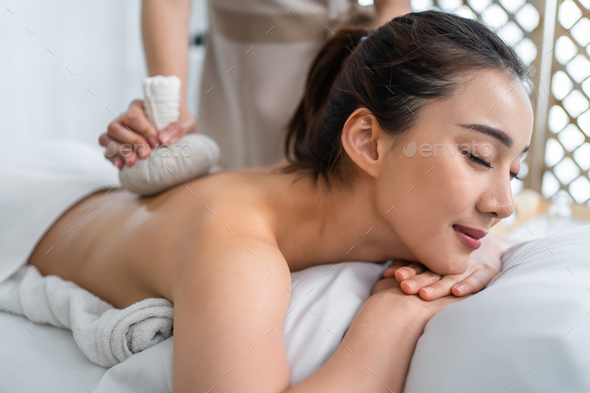 Body care. Woman enjoying relaxing back massage Stock Photo by