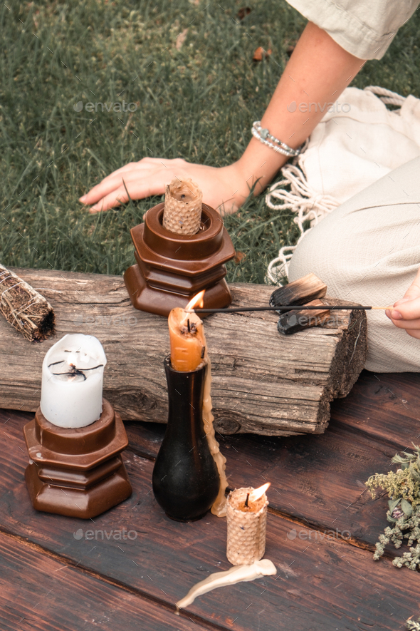 Woman Inhaling Incense Smoke During Meditation Ground level of relaxed