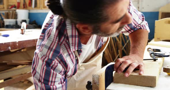 Carpenter working on his craft alt