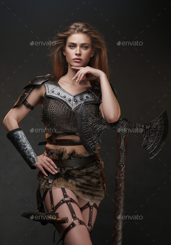 Stunning Viking girl dressed in a chainmail top and fur skirt