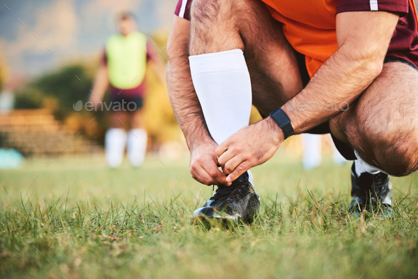 Rugby, hands and athlete tie shoes to start workout, exercise or fitness. Sports, player and man ty