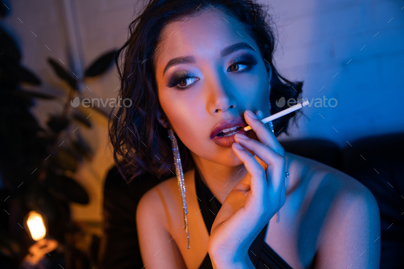 beautiful women lighting cigarettes
