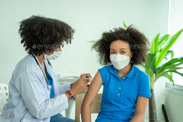 Doctor giving vaccination girl,Health,Prevention,Vaccine.