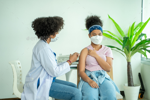 Doctor giving vaccination girl,Health,Prevention,Vaccine.