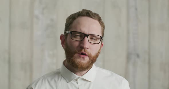 Man Yawning at the Camera