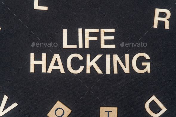 LIFE HACKING word written on dark paper background. LIFE HACKING text for your concepts